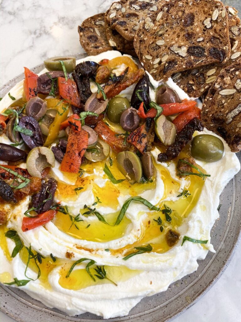 Goat-Cheese-spread-with-sun-dried-tomatoes,-olives-and-roasted-red-peppers