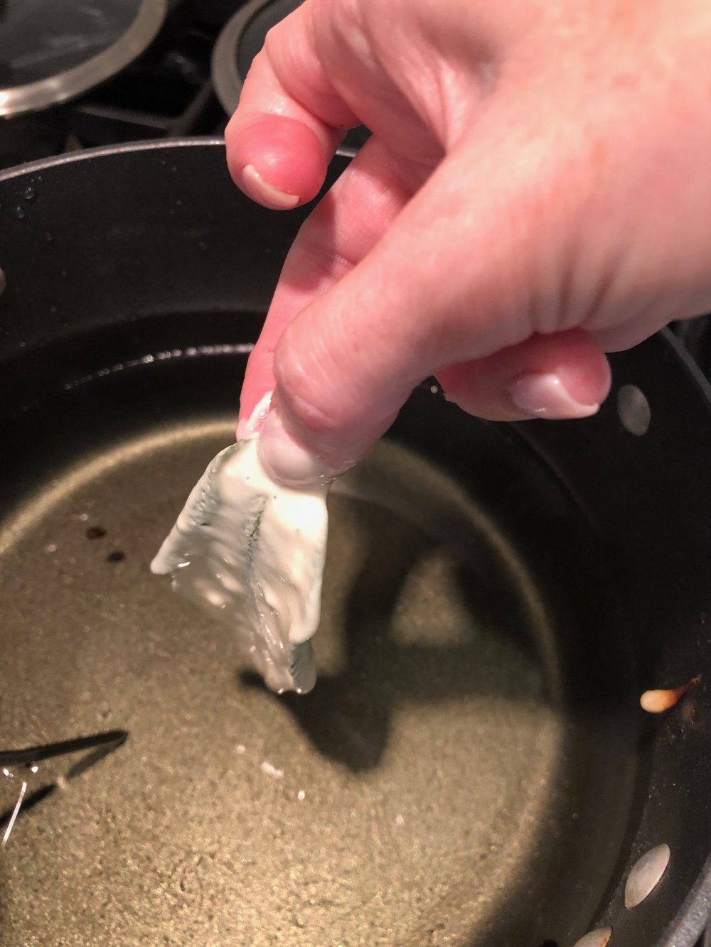Gently lay one feat at a time into the hot oil.