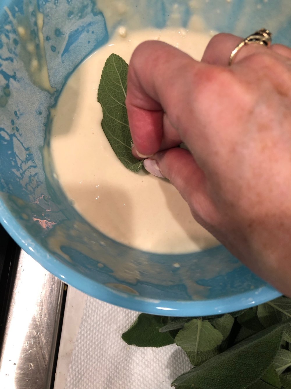 Be sure to coat both sides of the leaf with the batter.