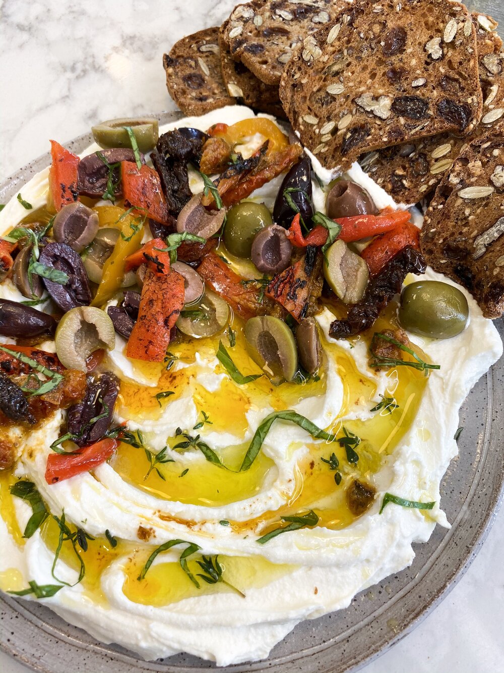 Goat Cheese spread with sun-dried tomatoes, olives and roasted red peppers