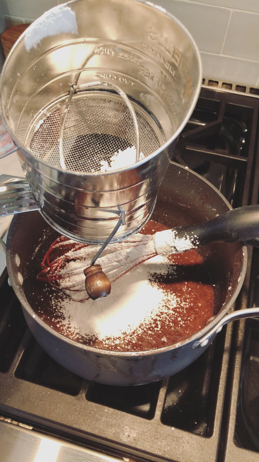 Sifting confectioner sugar for icing