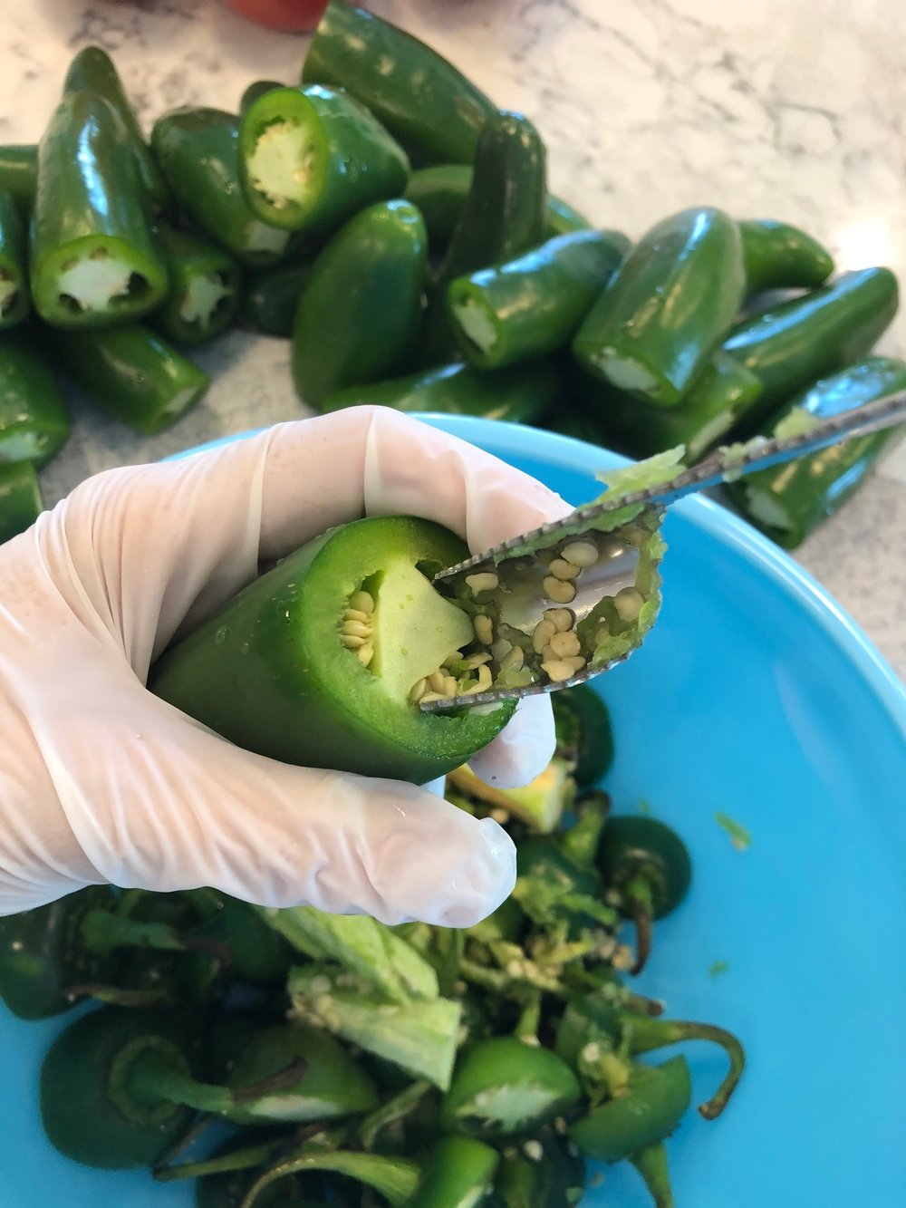 Step 2 - Gently wiggle in the tool then twist to release the pith and seeds.