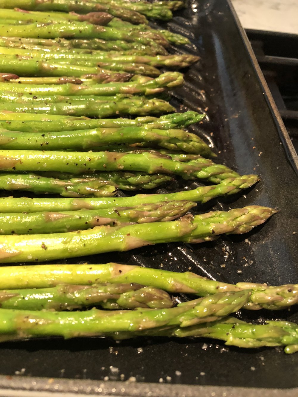 ASparagus cooks up quick on a grill pan. I toss it in olive oil, salt and pepper and finish with a little lemon.