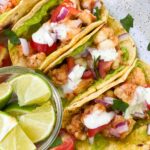 SHRIMP STREET TACOS in a corn tortilla with a side of lime