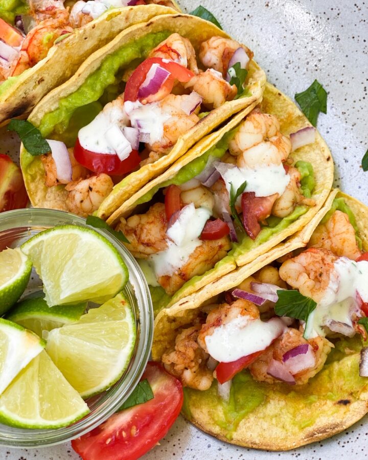 SHRIMP STREET TACOS in a corn tortilla with a side of lime