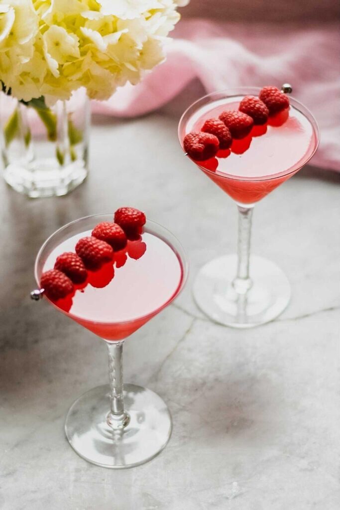two martini glasses filled with pink drink